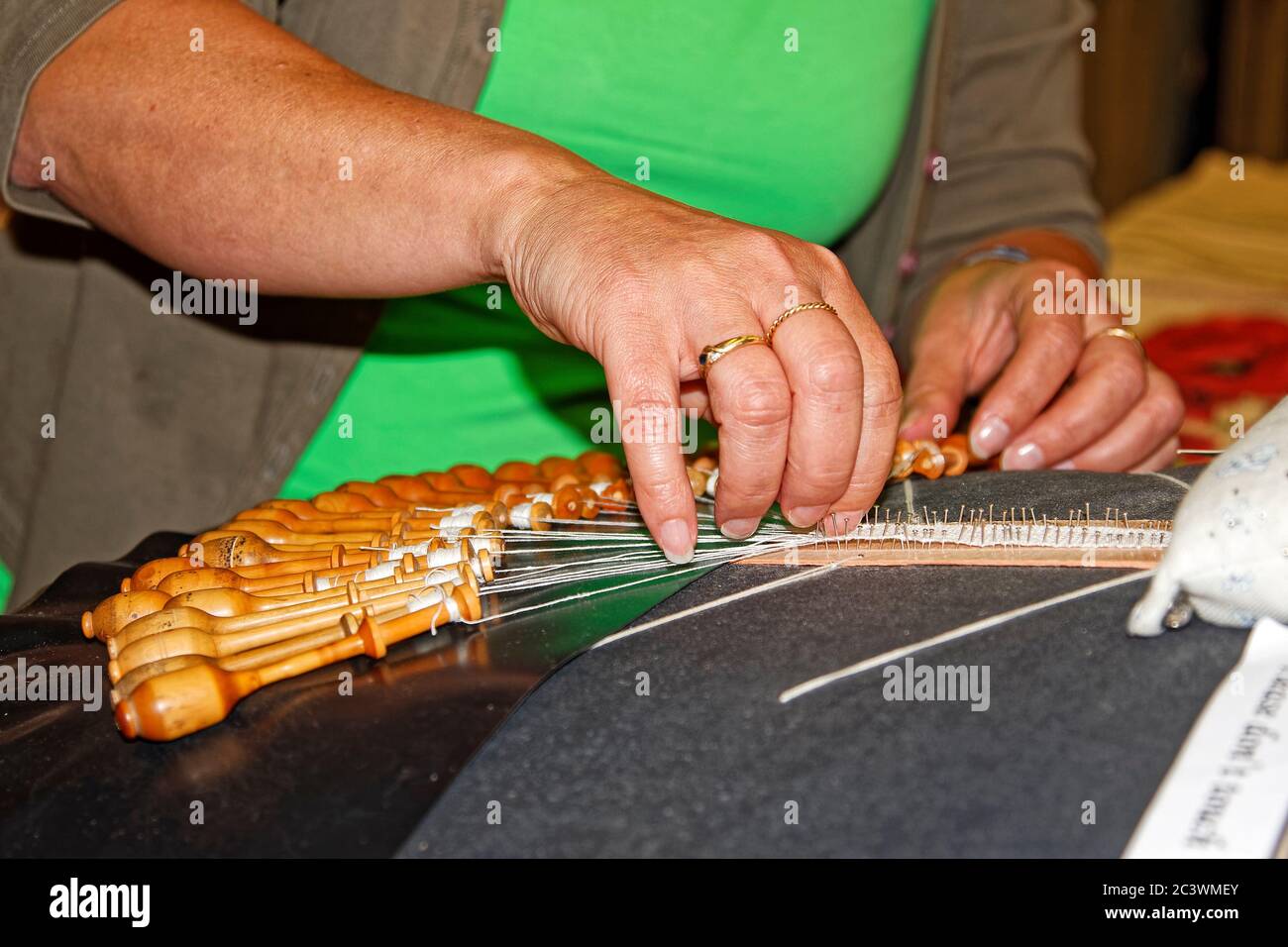 woman making fine bobbin lace; skilled craft; occupation; close-up; hands; fiber art, intricate, job, occupation, Europe, Bruges; Brugge; Belgium Stock Photo