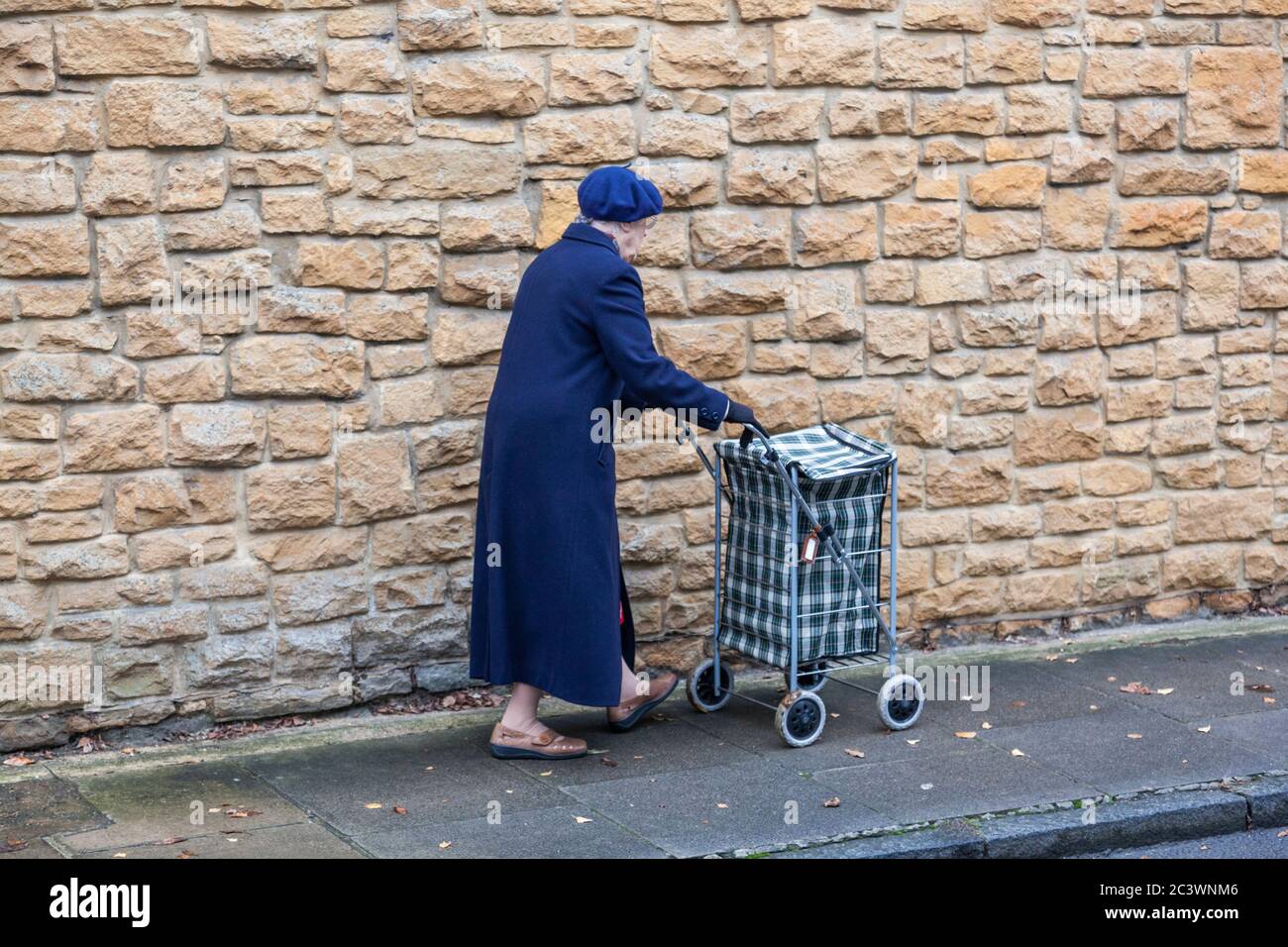 Elderly woman shopping trolley walking hi-res stock photography and images  - Alamy