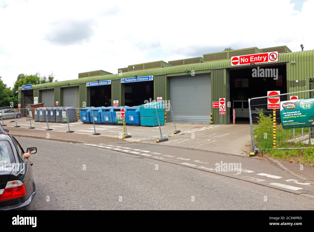 Cars queuing and waiting to enter the Mile Cross Recycling Centre under