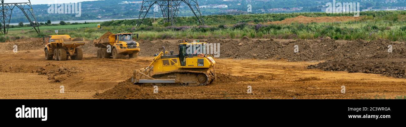 Kingsnorth Sand and Gravel quarry, carrying out exploration work on phase two. A Bulldozer is smoothing out  top soil which has been transported over. Stock Photo