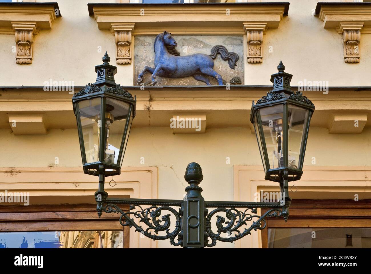 Old lantern and Blue Horse sign on house at Male Namesti in Old Town, Prague, Czech Republic Stock Photo