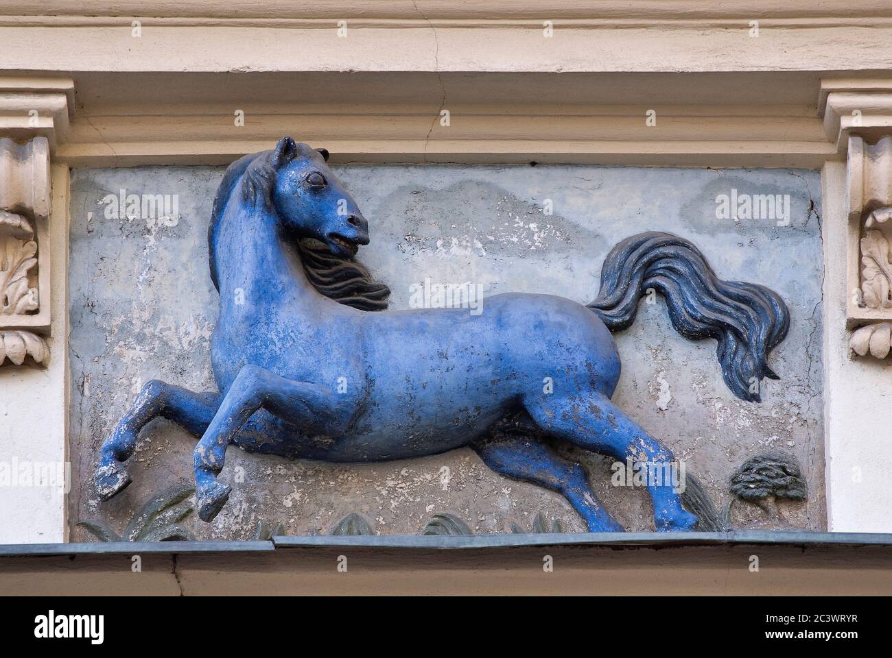 Blue Horse high relief sculpture sign on house at Male Namesti in Old Town, Prague, Czech Republic Stock Photo