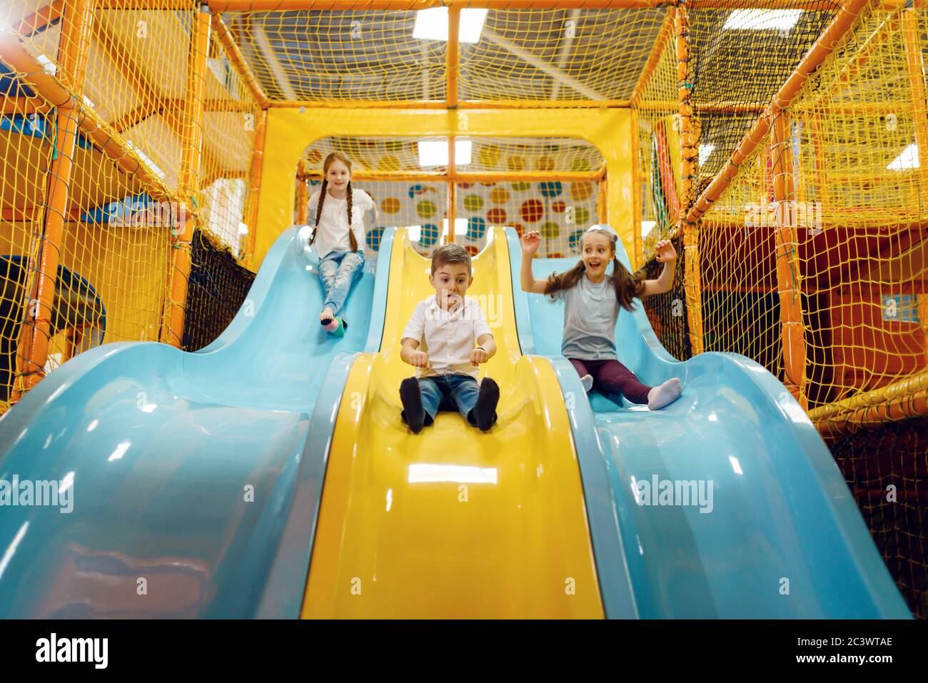 Children ride down the hill, entertainment center Stock Photo Alamy