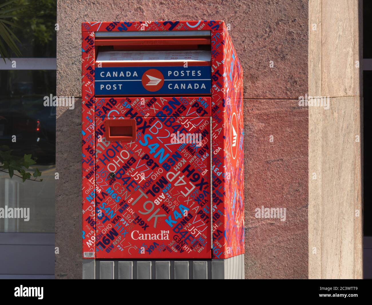 Toronto Canada, June 17, 2020; A Canada Post mail drop red postbox with  graphic postal code decoration Stock Photo - Alamy