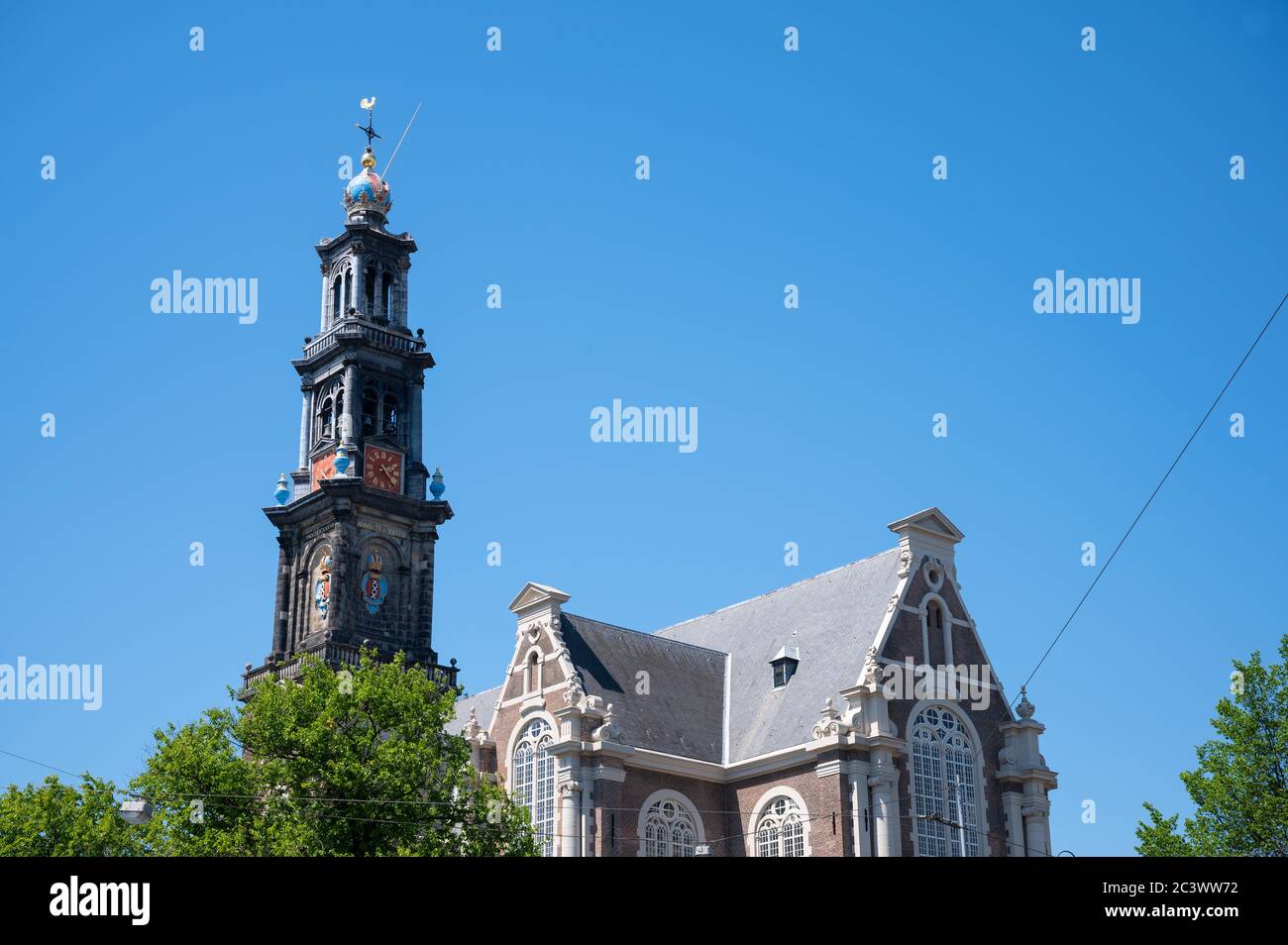 Westerkerk on Prinsengracht in Amsterdam has a crown-topped spire rising from this Renaissance-era Protestant church where Rembrandt is buried Stock Photo