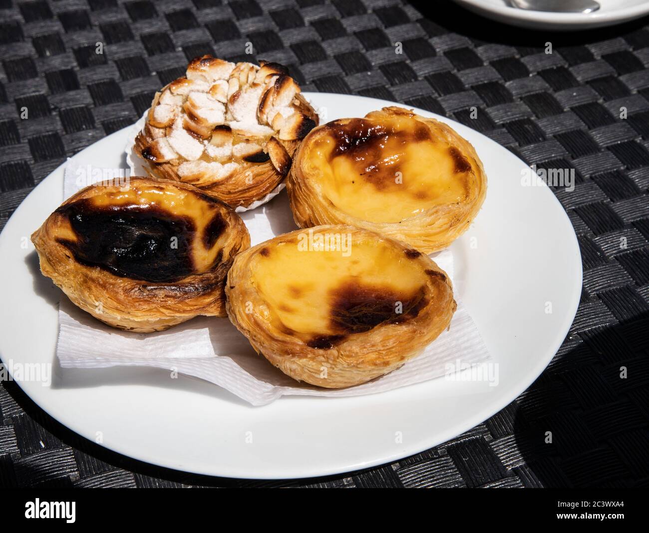 Traditional Portuguese custard tarts, Pastéis de Nata and almond tart