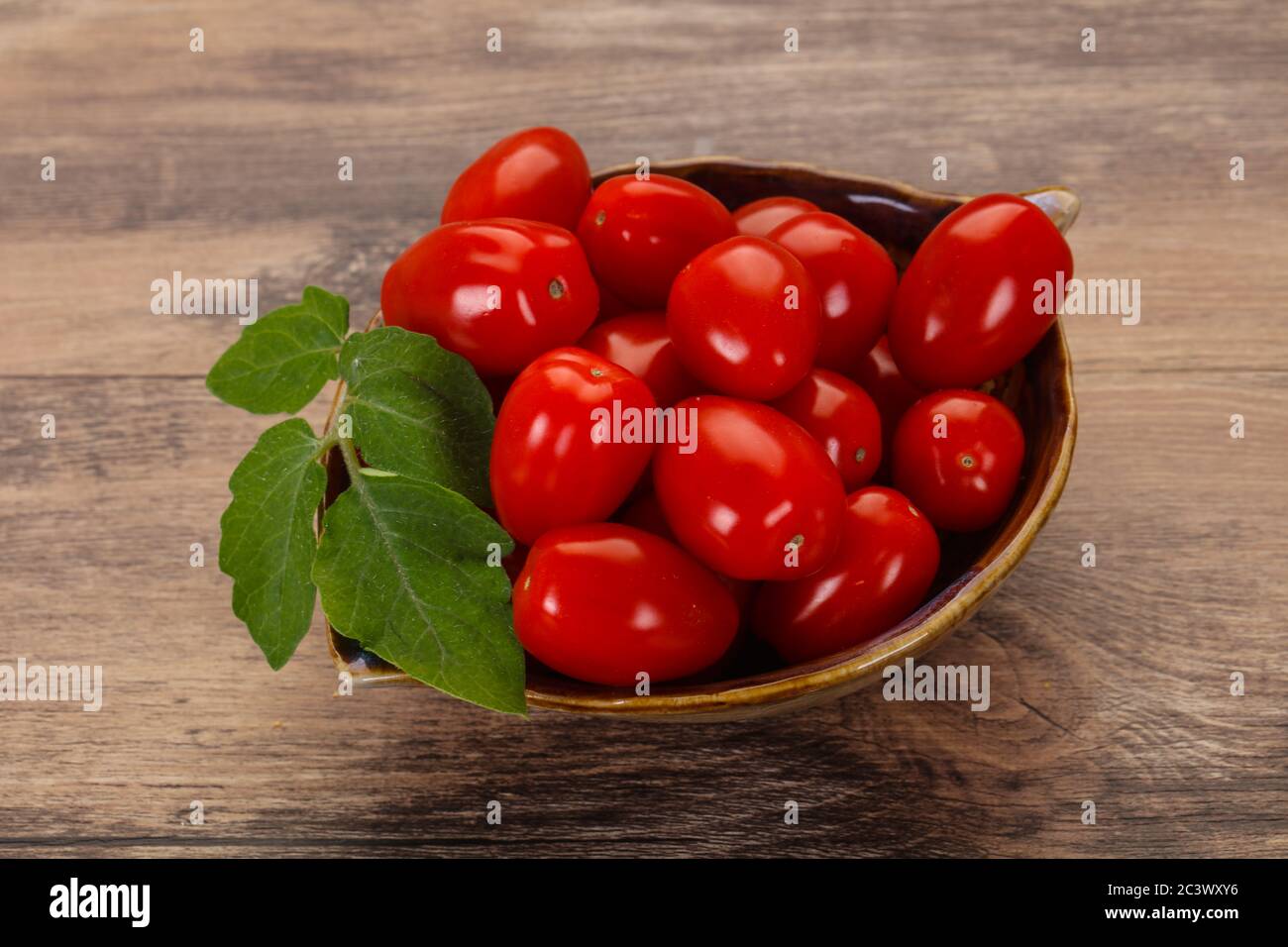 Sweet Red cherry tomatoes in the bowl Stock Photo - Alamy