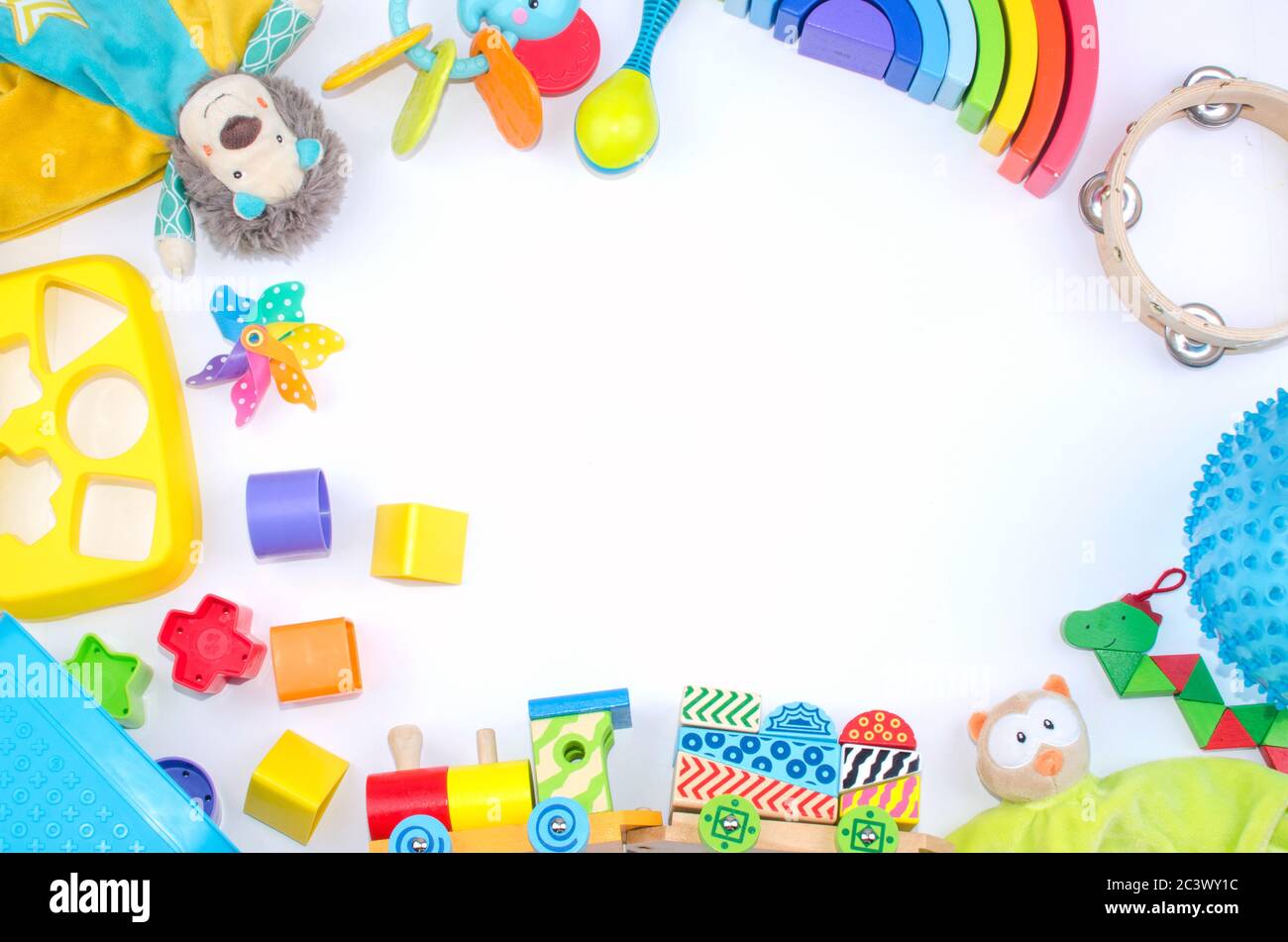 circle of colored toys and space for text in the middle of the image Stock Photo