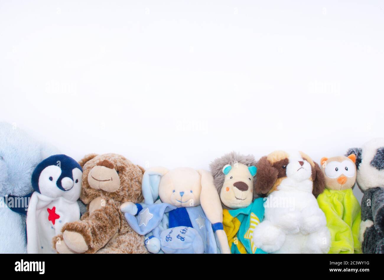 circle of various stuffed animals and space for text in the middle of the image Stock Photo