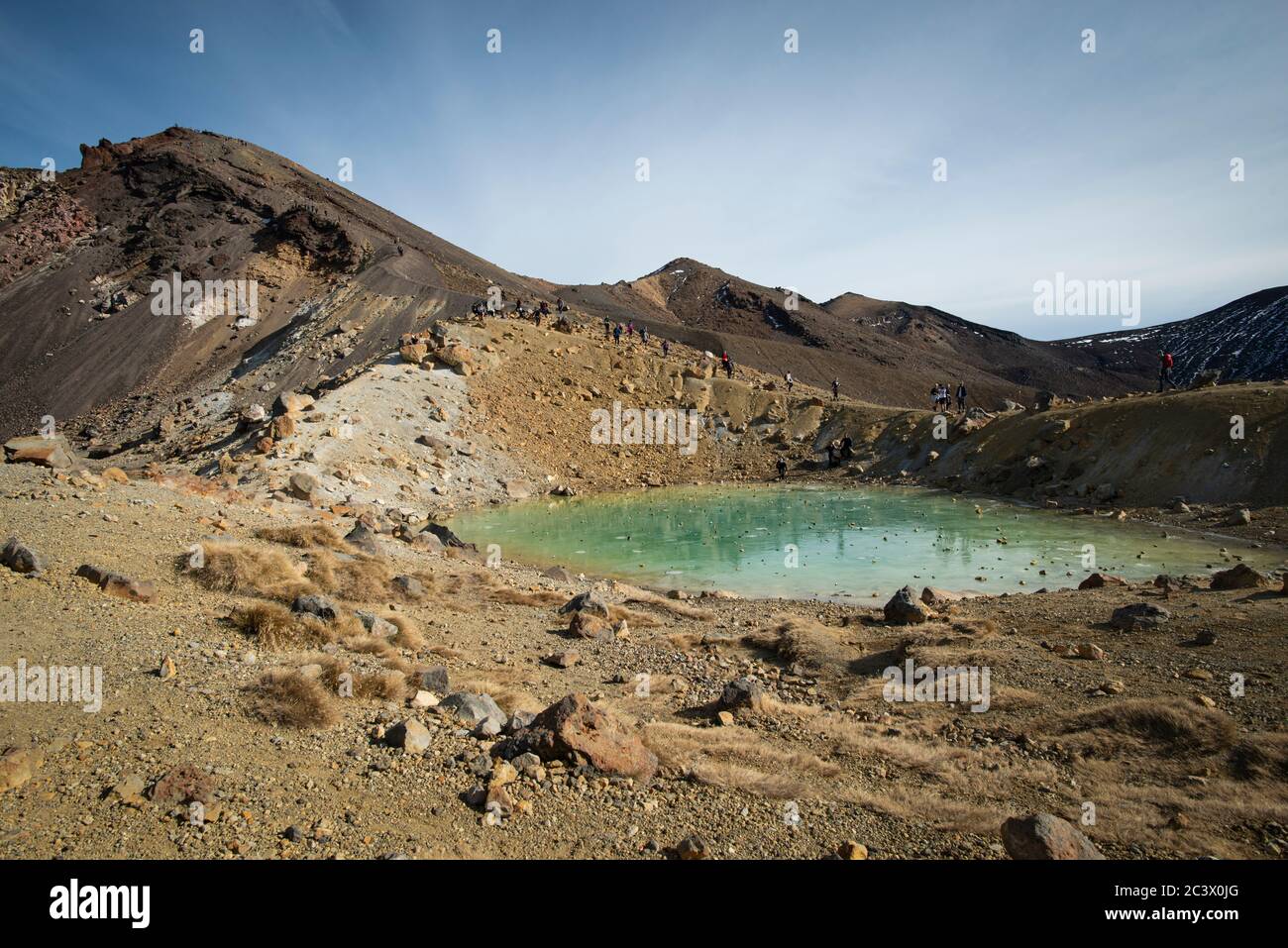 Looking up at the Red Crater from the frozen Emerald lake on the Tongariro Alpine Crossing Stock Photo