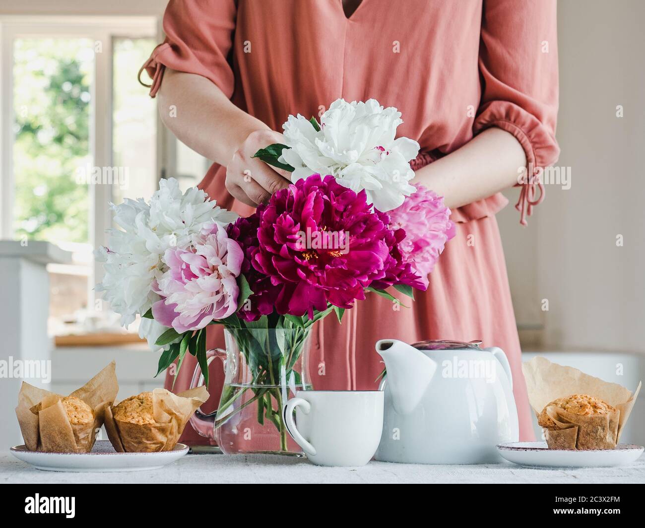 Young woman and a beautiful bouquet of flowers Stock Photo - Alamy