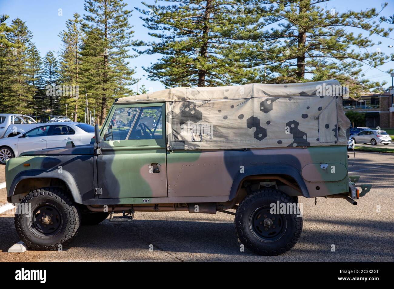 Land Rover defender soft top in camouflage in Sydney,Australia Stock Photo