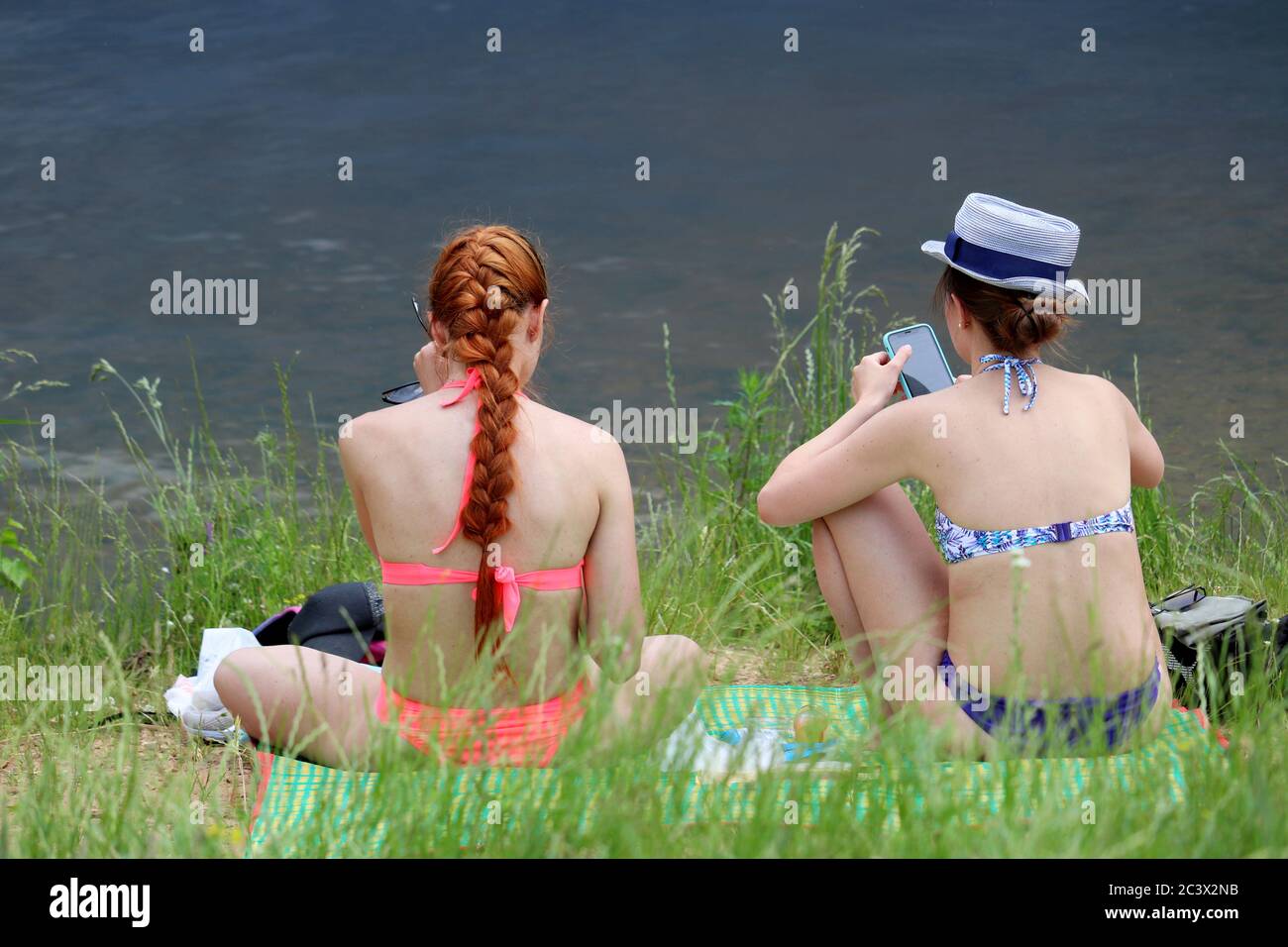 Teenager beach bikini sitting hi-res stock photography and images - Alamy