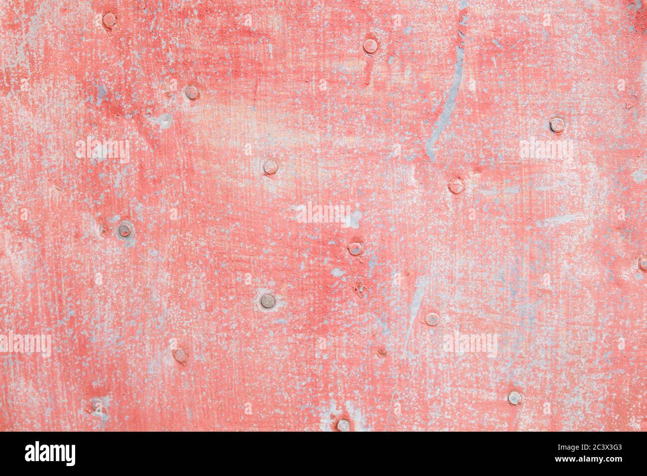 Old rusted pink painted metallic sheet Stock Photo