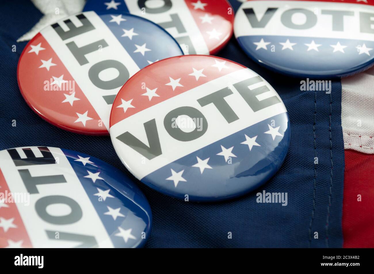 Democrat vs republican poll, democratic decision and primary voting conceptual idea with Vote election campaign button badges and the united states of Stock Photo