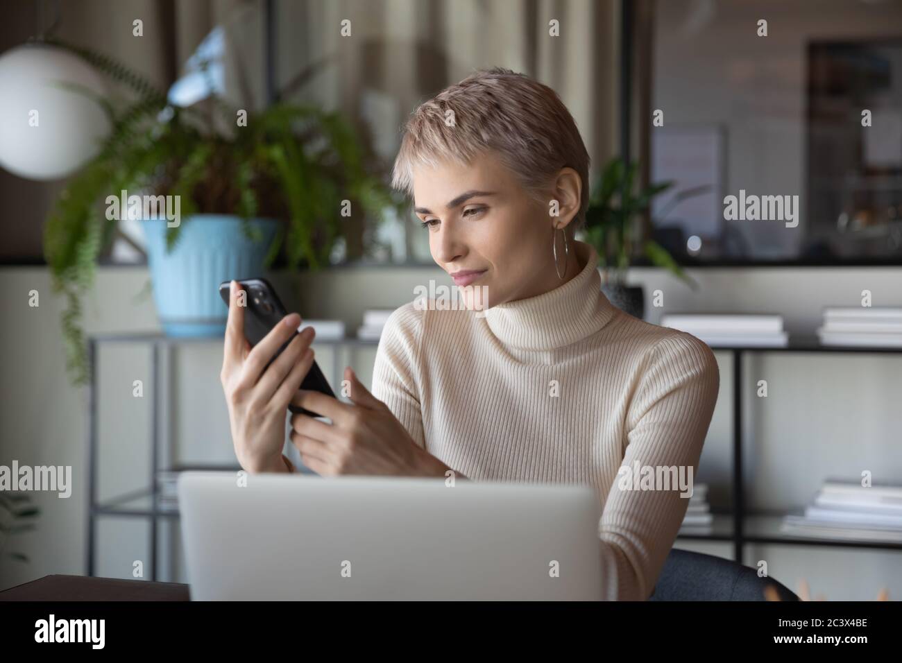 Businesswoman holding smartphone using agenda planning business meetings with clients Stock Photo
