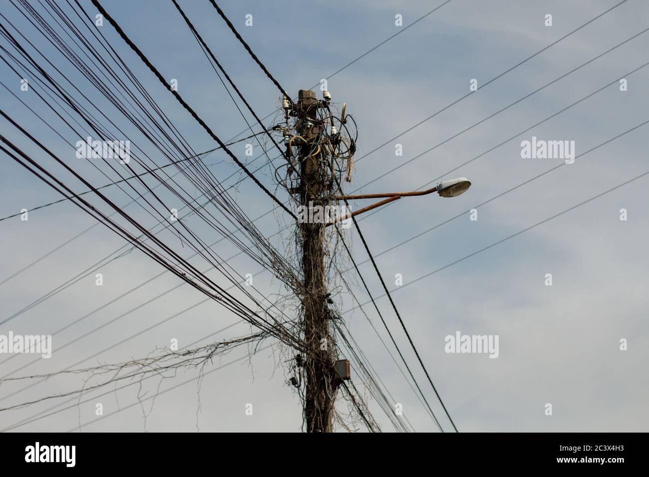 pole with electric wires in village Stock Photo - Alamy