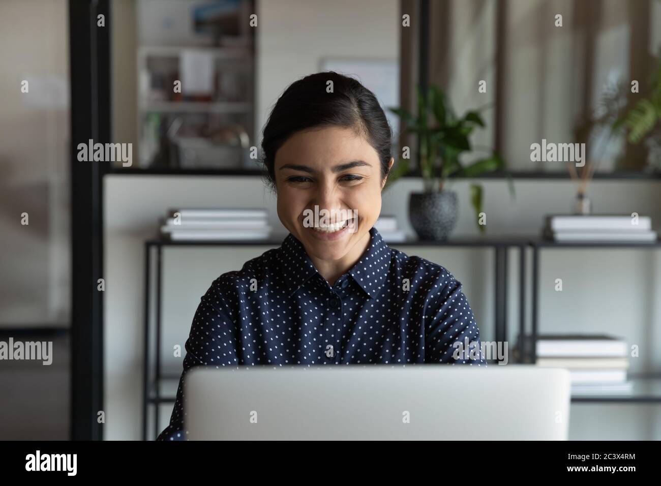 Indian student reading e-mail about scholarship approval feels excited Stock Photo