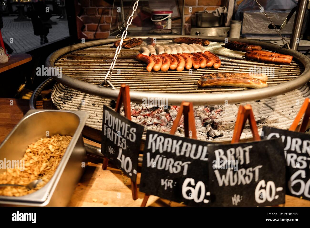 Copenhagen / Denmark - November 2019: Street food at Scandinavian Christmas  market. Different sausages on a bratwurst barbecue grill Stock Photo - Alamy