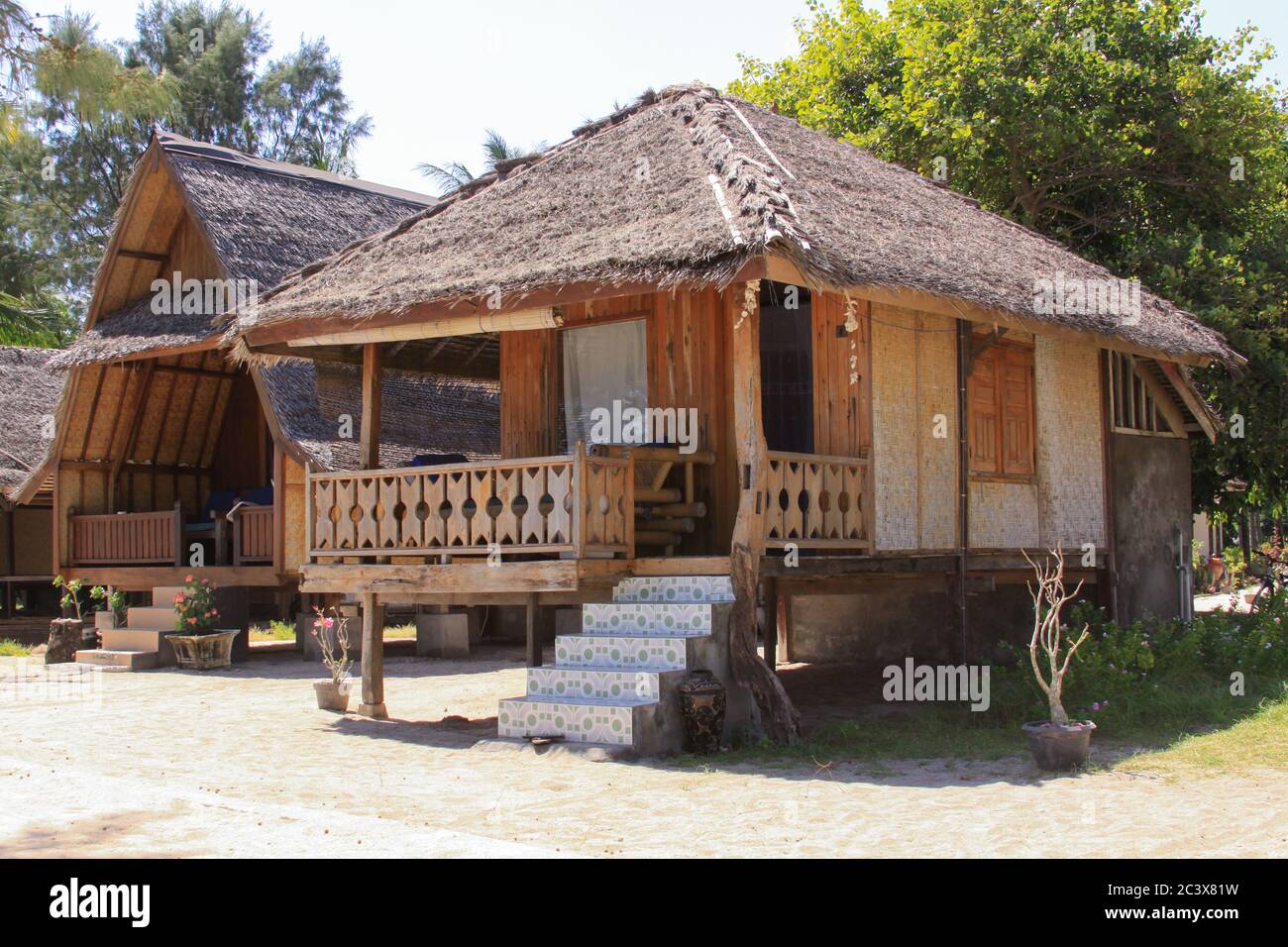 Tropical guest house bungalow on sunny beach on Gili Air island, Lombok, Indonesia Stock Photo