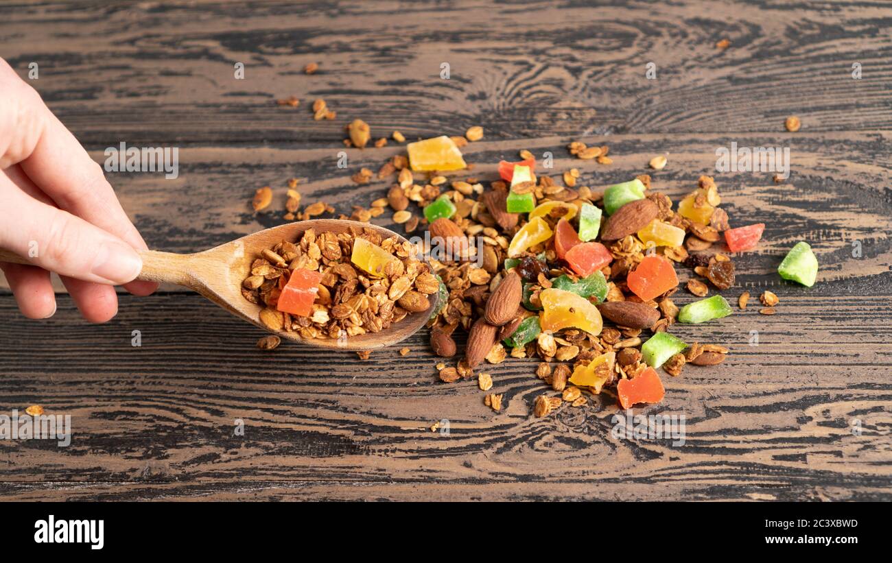 Granola for children. Colorful and fun food for the little ones. Wooden table. Healthy and energetic food for breakfast Stock Photo