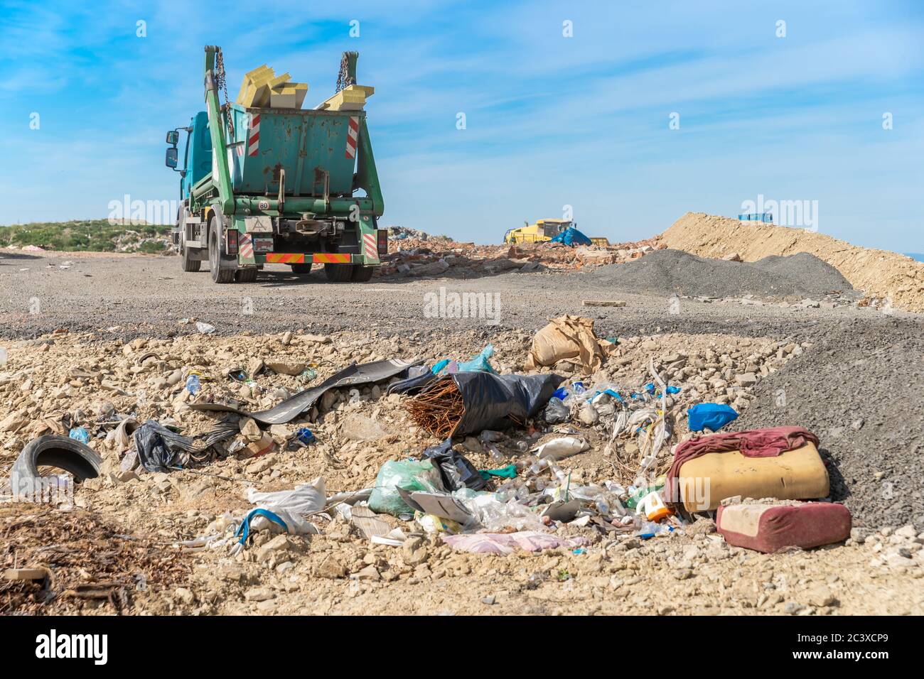 the garbage truck brought the waste to the landfill Stock Photo Alamy