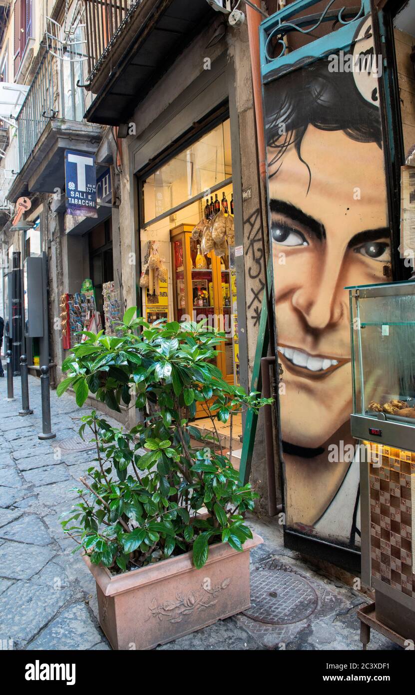 Narrow cobblestone Side Street with sidewalk cafes and souvenir shops