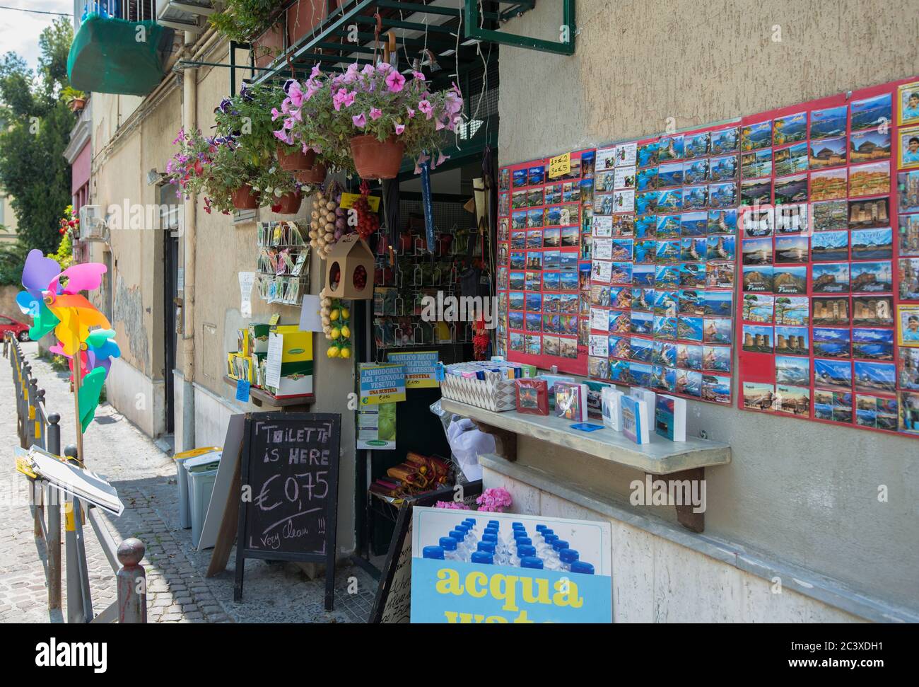 Narrow cobblestone Side Street with sidewalk cafes and souvenir shops