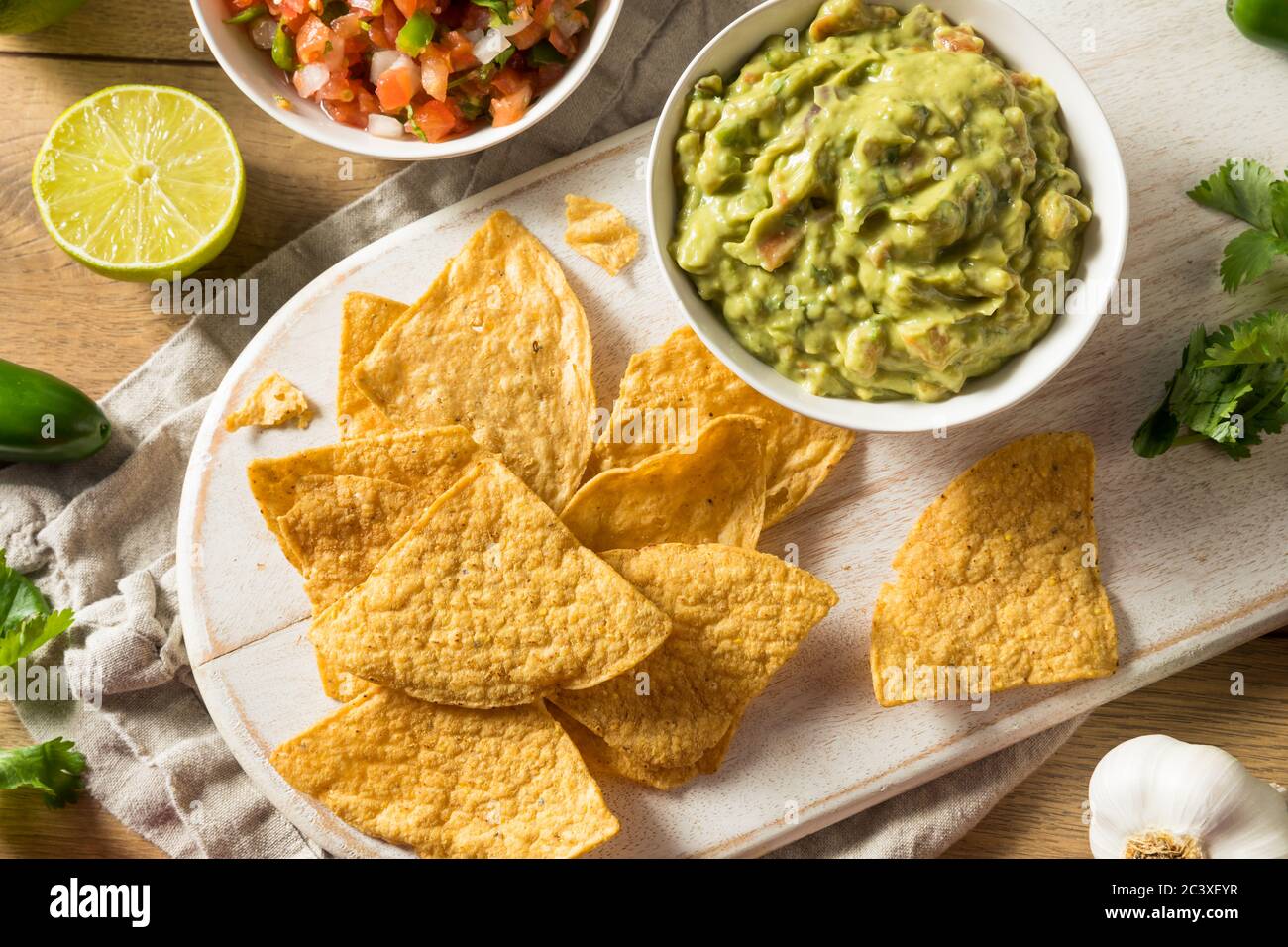 Homemade Tortillas Chips with Salsa and Guacamole with Lime Stock Photo Alamy