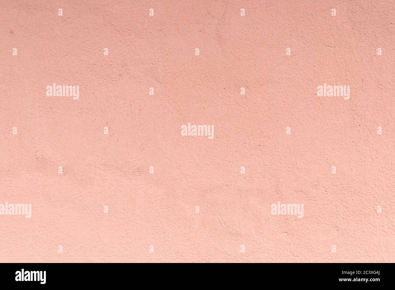 Texture of plastered wall painted with peacj color. Exterior paint, background, close-up, wallpaper, copy space Stock Photo