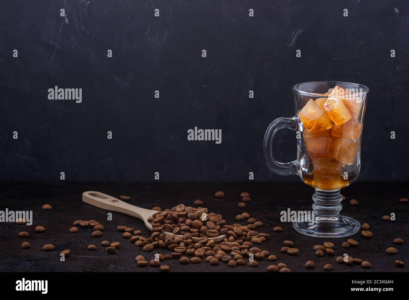 Frozen coffee ice cubes in a glass before pouring coffee Stock Photo