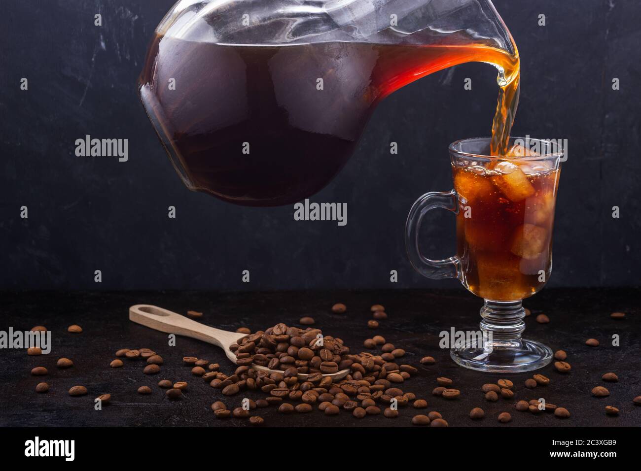 Cold brewing coffee is poured into a glass of coffee ice Stock Photo