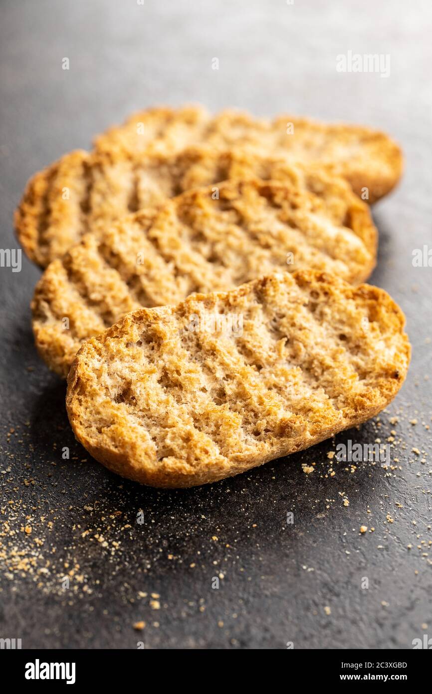 Rusk bread. Dried crispbread on kitchen table. Stock Photo