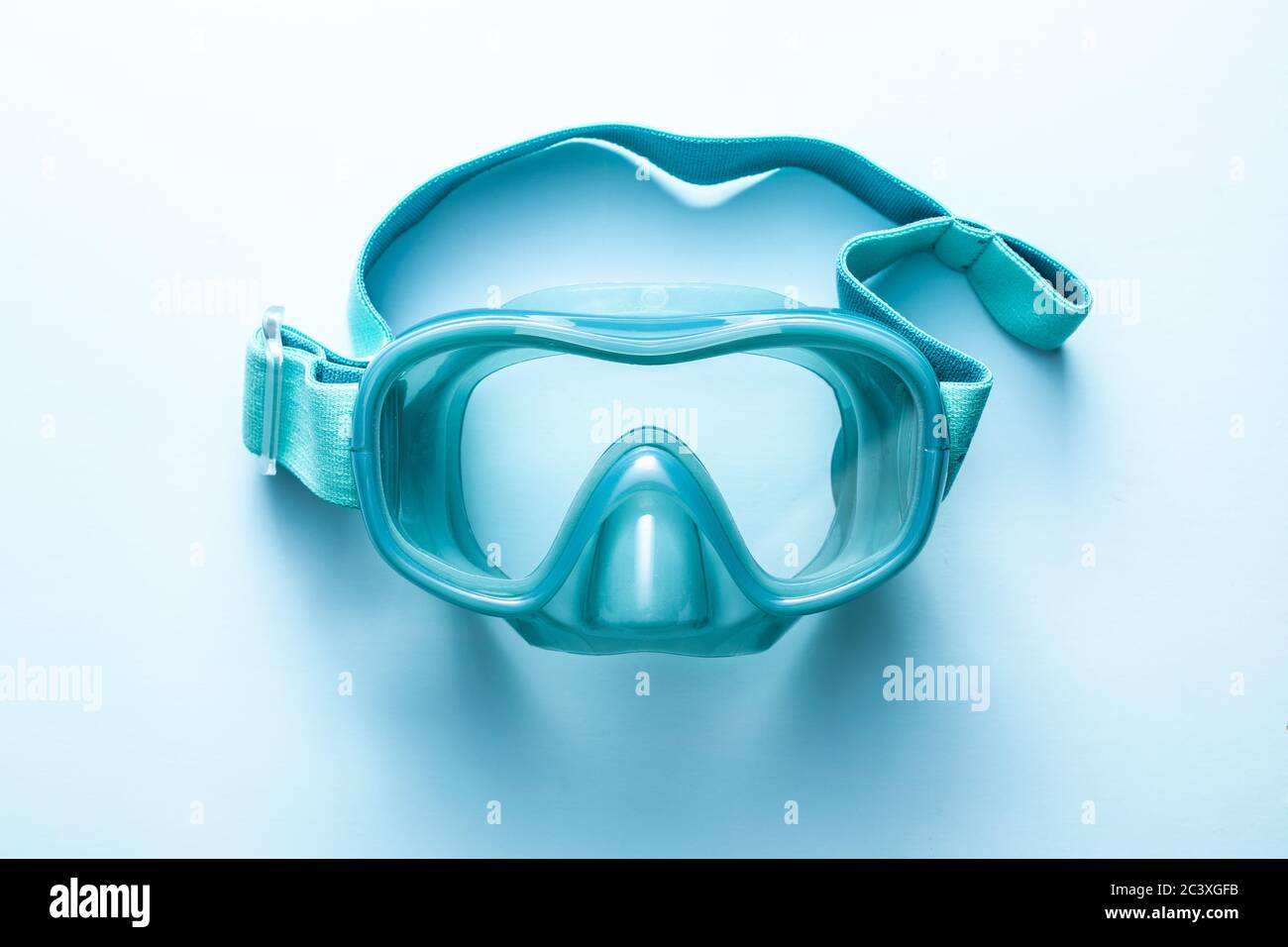 Blue diving mask on blue background. Top view. Stock Photo