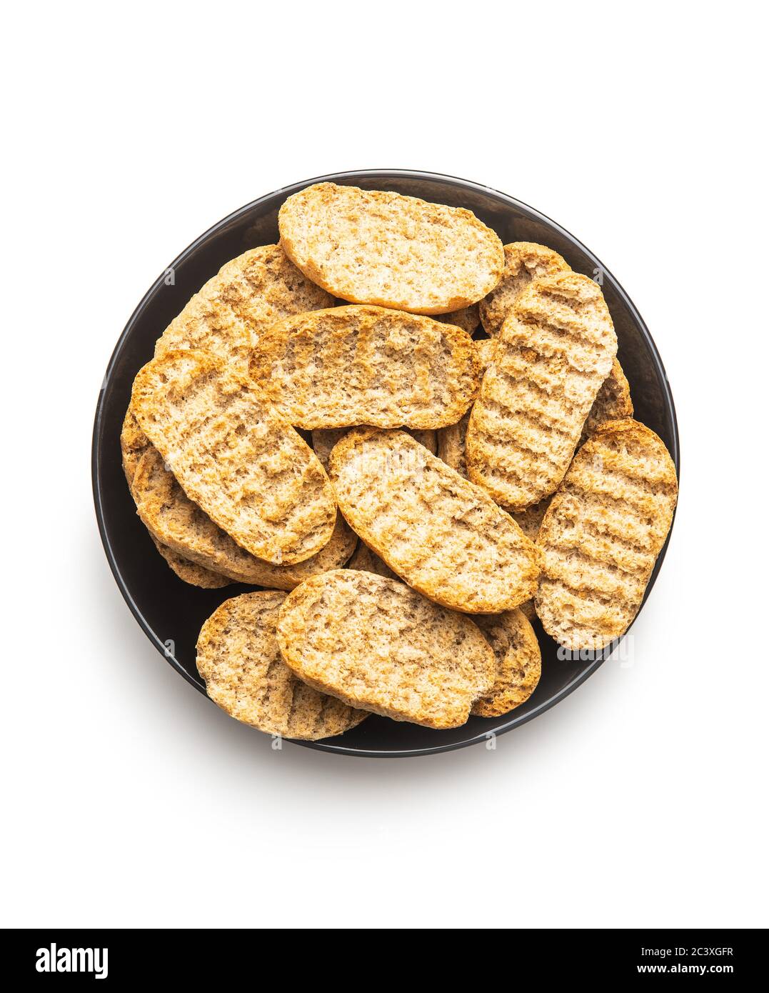 Rusk bread. Dried crispbread on table isolated on white background. Stock Photo