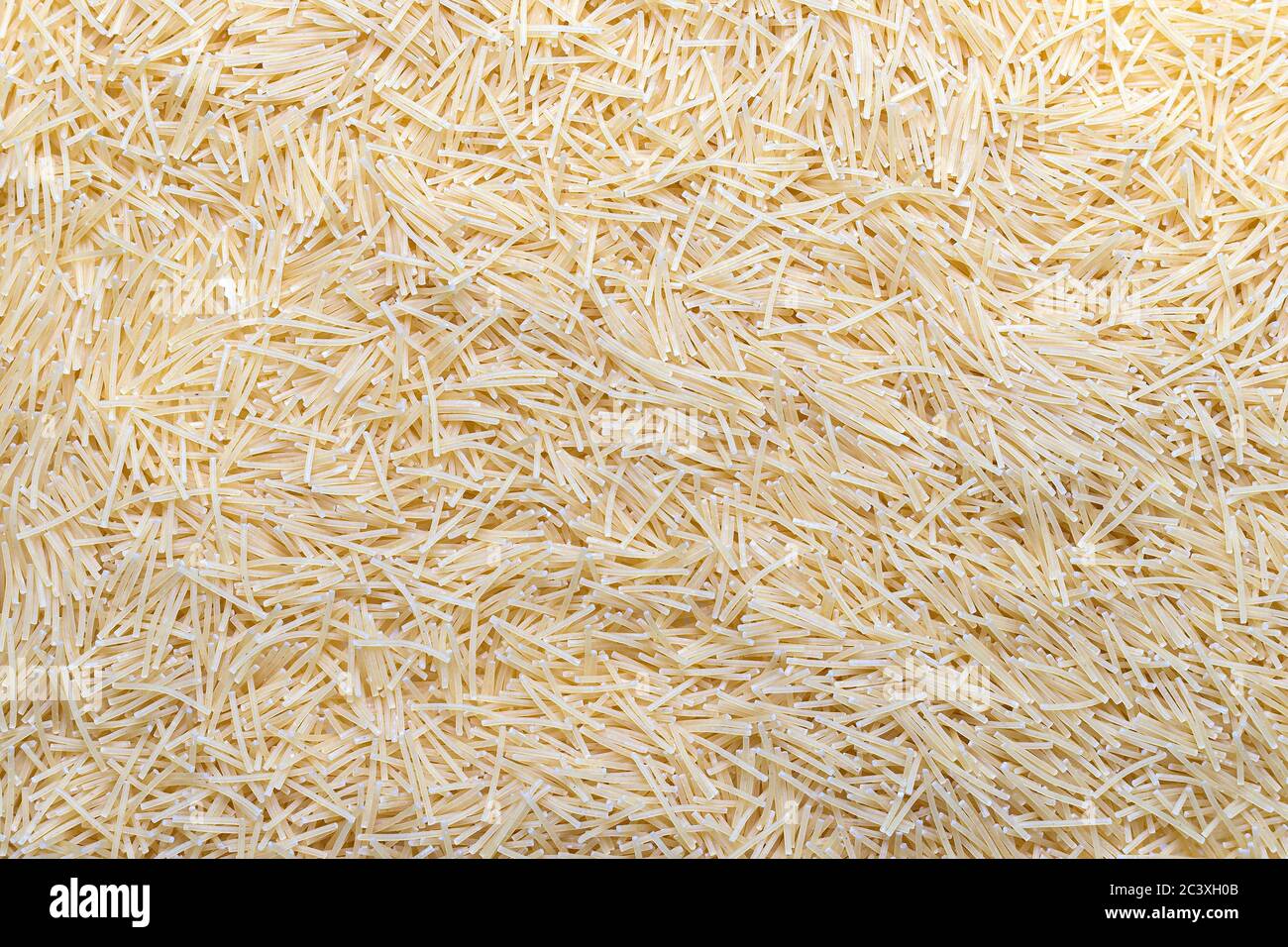 Scattered and uncooked vermicelli texture. Pastry pattern, food background, texture idea Stock Photo