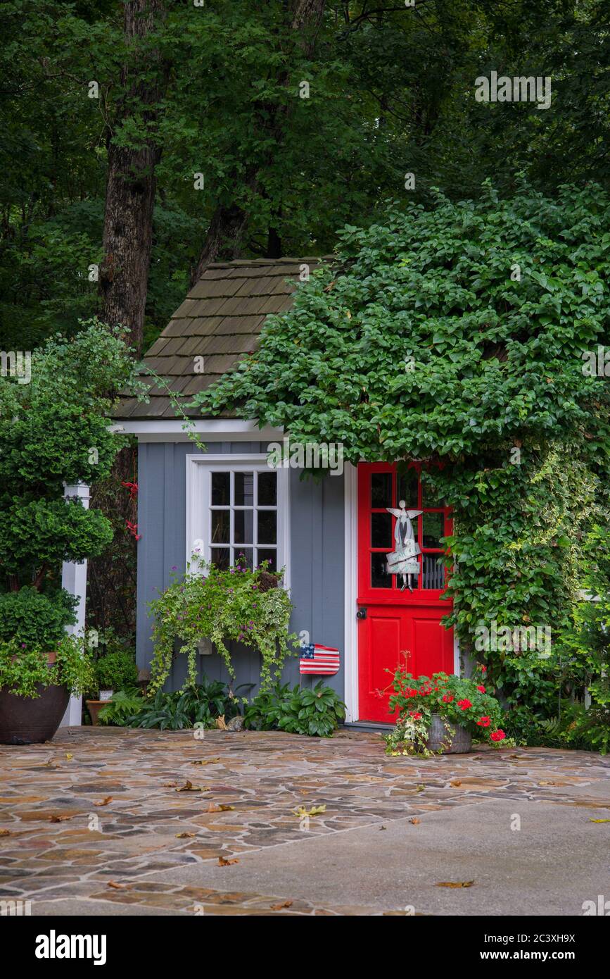 Potting  shed with red  door Stock Photo