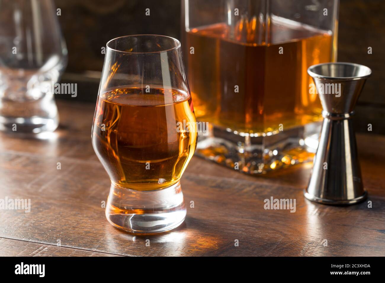 Boozy Amber Whiskey in a Snifter Ready to Drink Stock Photo