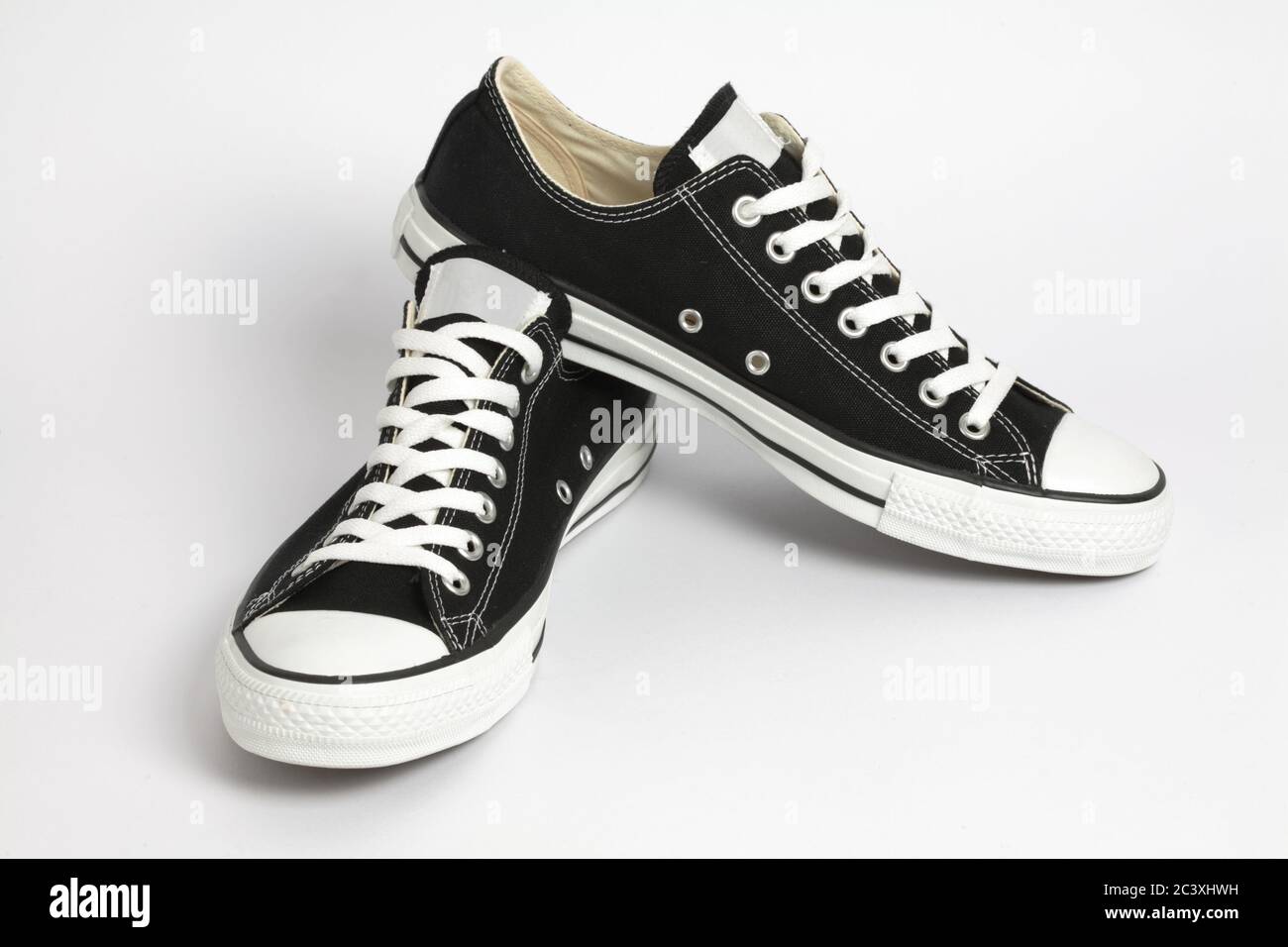 Black canvas sneakers, isolated Stock Photo