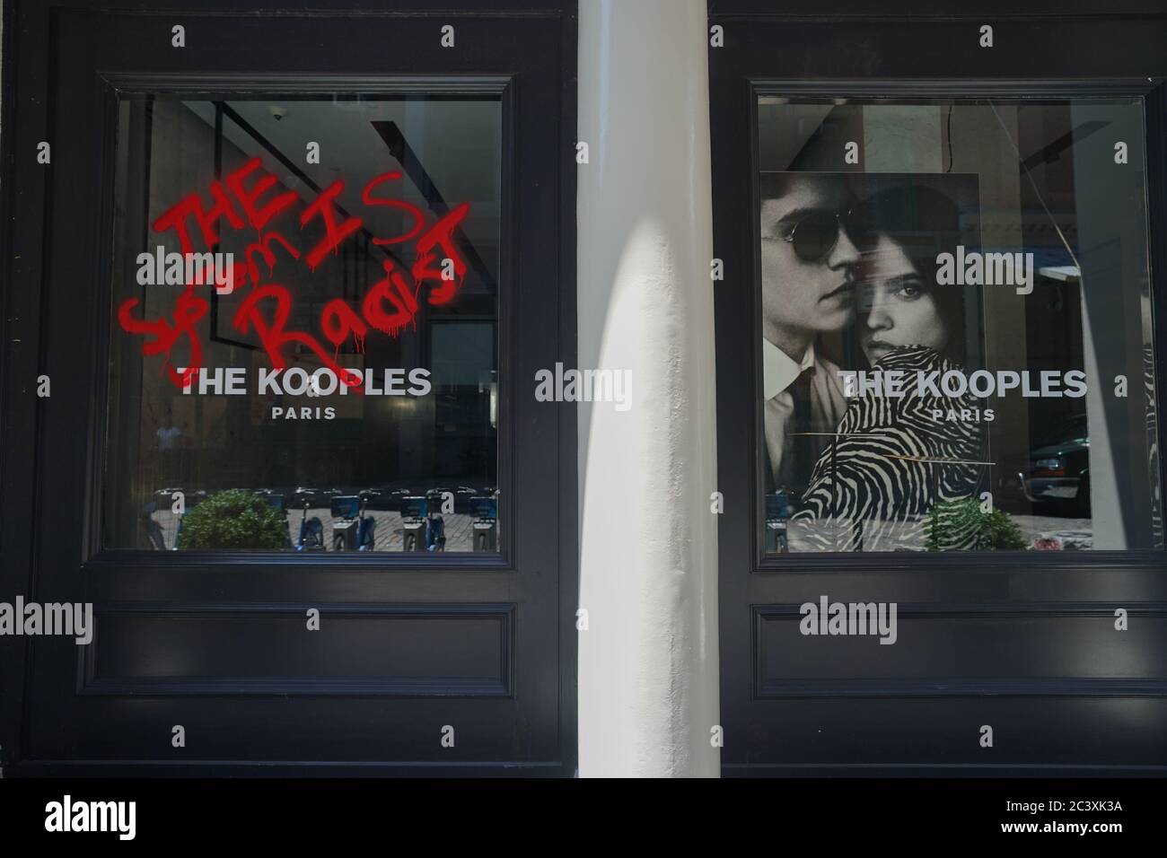 New York, NY, USA. 22nd June, 2020. Graffiti covers the windows at The Kooples store in Soho as New York City enters Phase 2 of reopening during the COVID-19 pandemic on June 22, 2020 in New York. Credit: Bryan Smith/ZUMA Wire/Alamy Live News Stock Photo