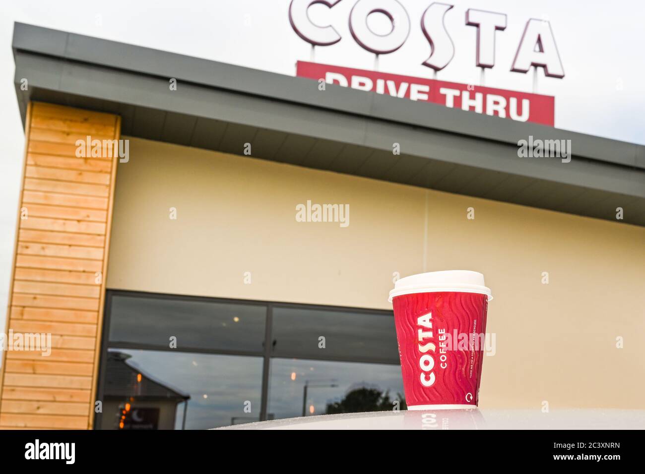 Talbot Green, Wales June 2020 Cup of coffee on the roof of a car in