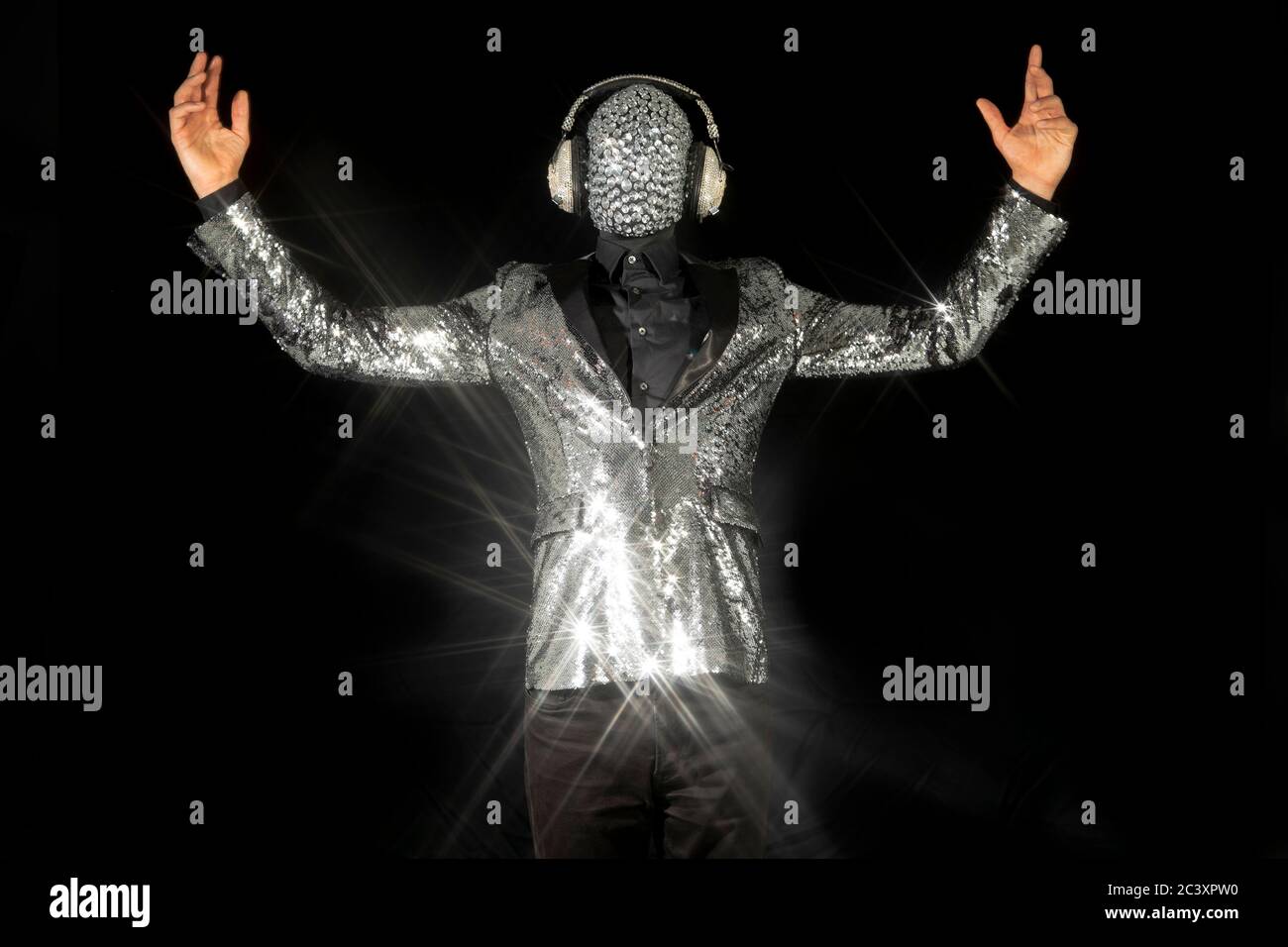 Mr disco ball wearing silver jacket dancing Stock Photo