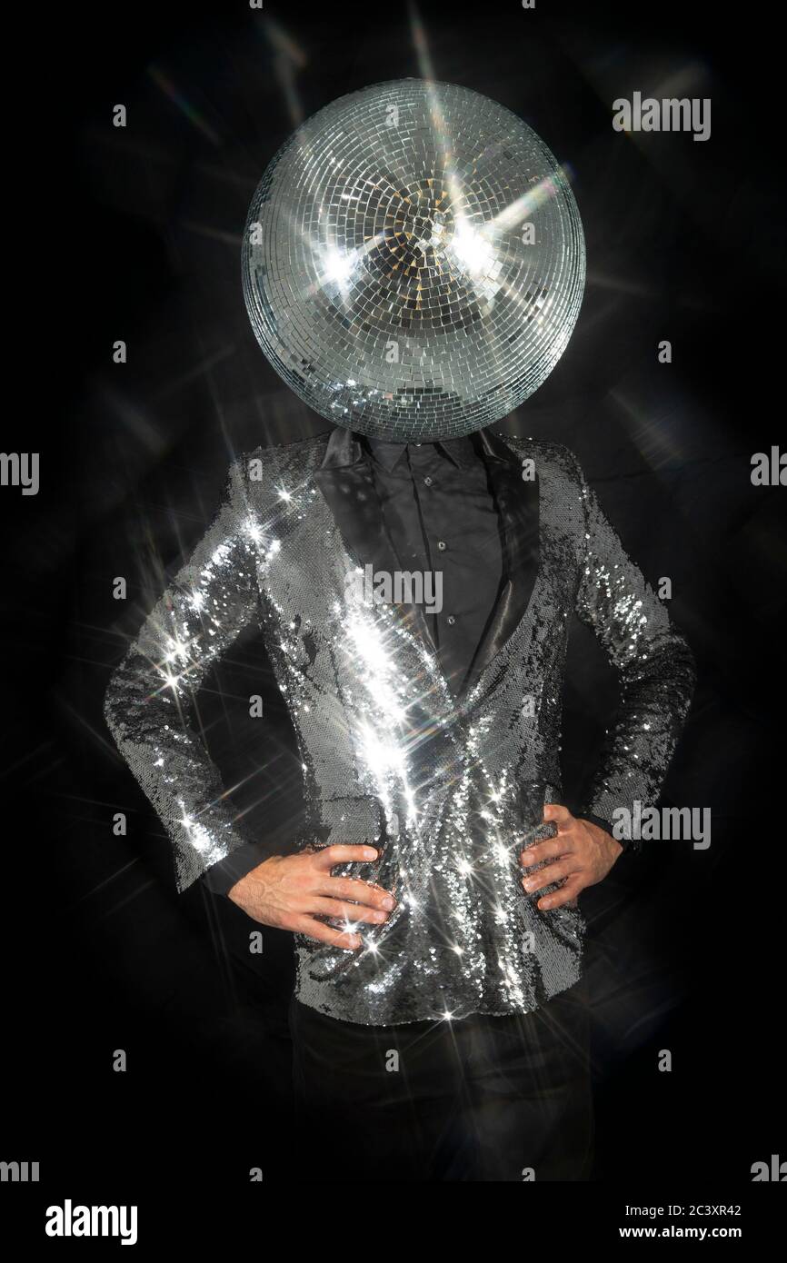 Mr disco ball wearing silver jacket dancing Stock Photo