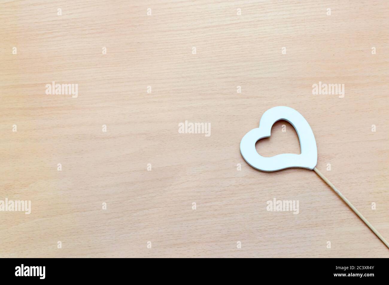 Heart shape symbol on wooden background. Stock Photo