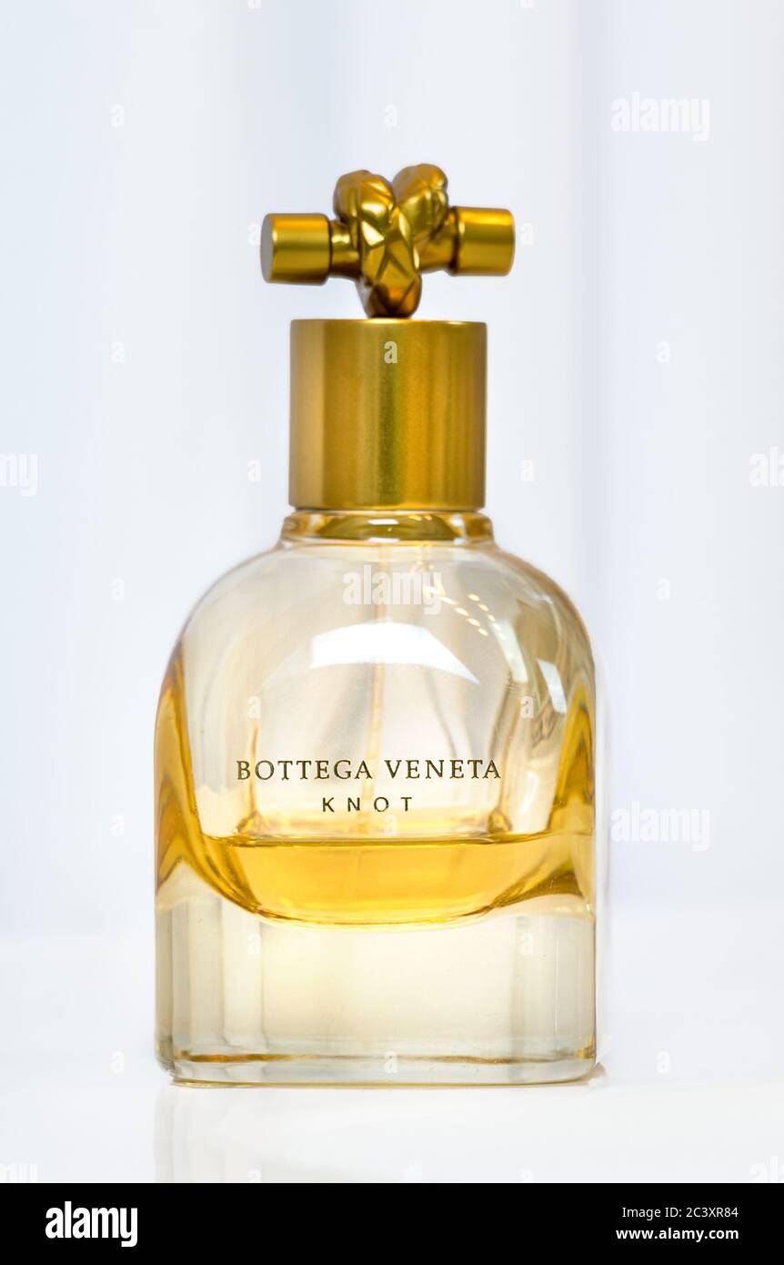 A bottle of Knot, a perfum made by Bottega Veneta over white. Stock Photo