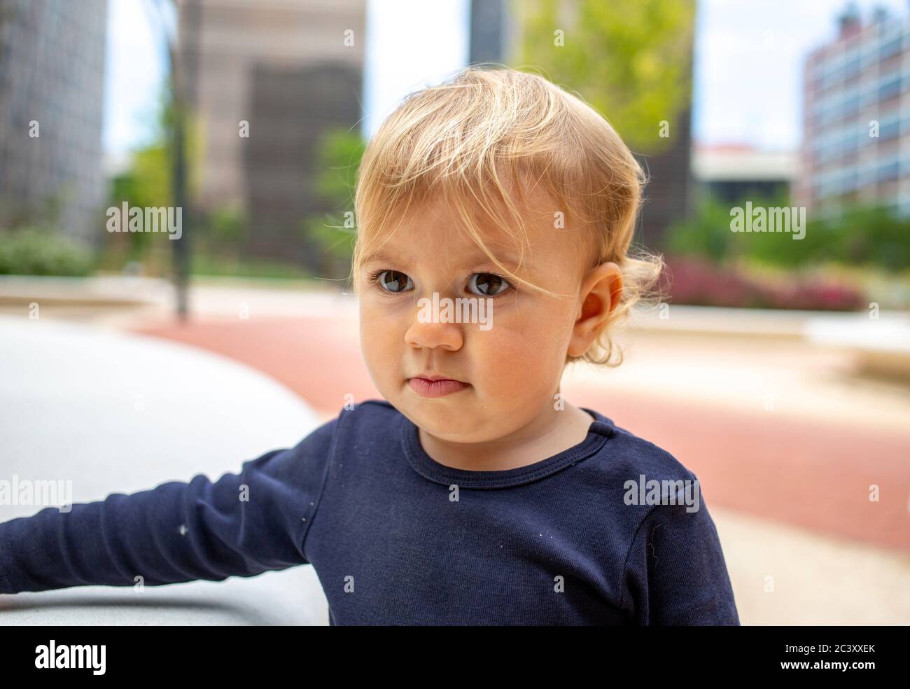 cute baby girl outdoors in a park Stock Photo