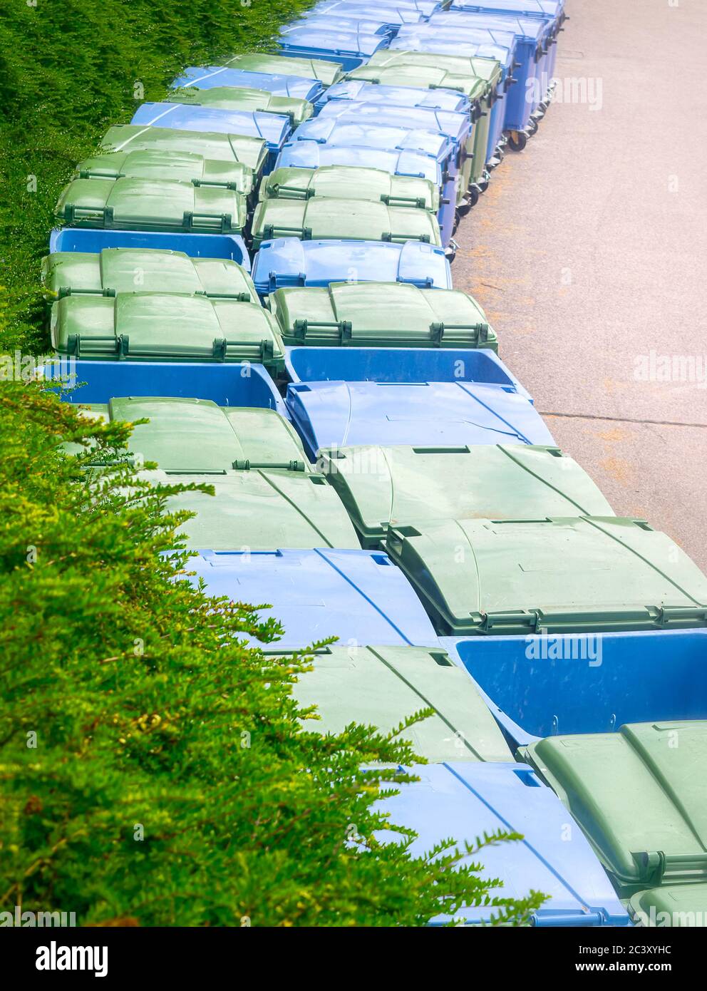 Green and blue recycling bins Stock Photo Alamy