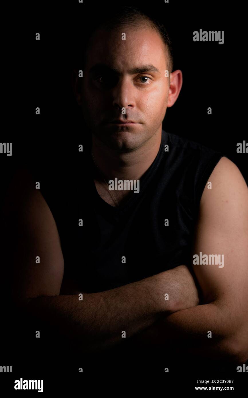 Portrait of a man with his half face and body in shadow Stock Photo - Alamy
