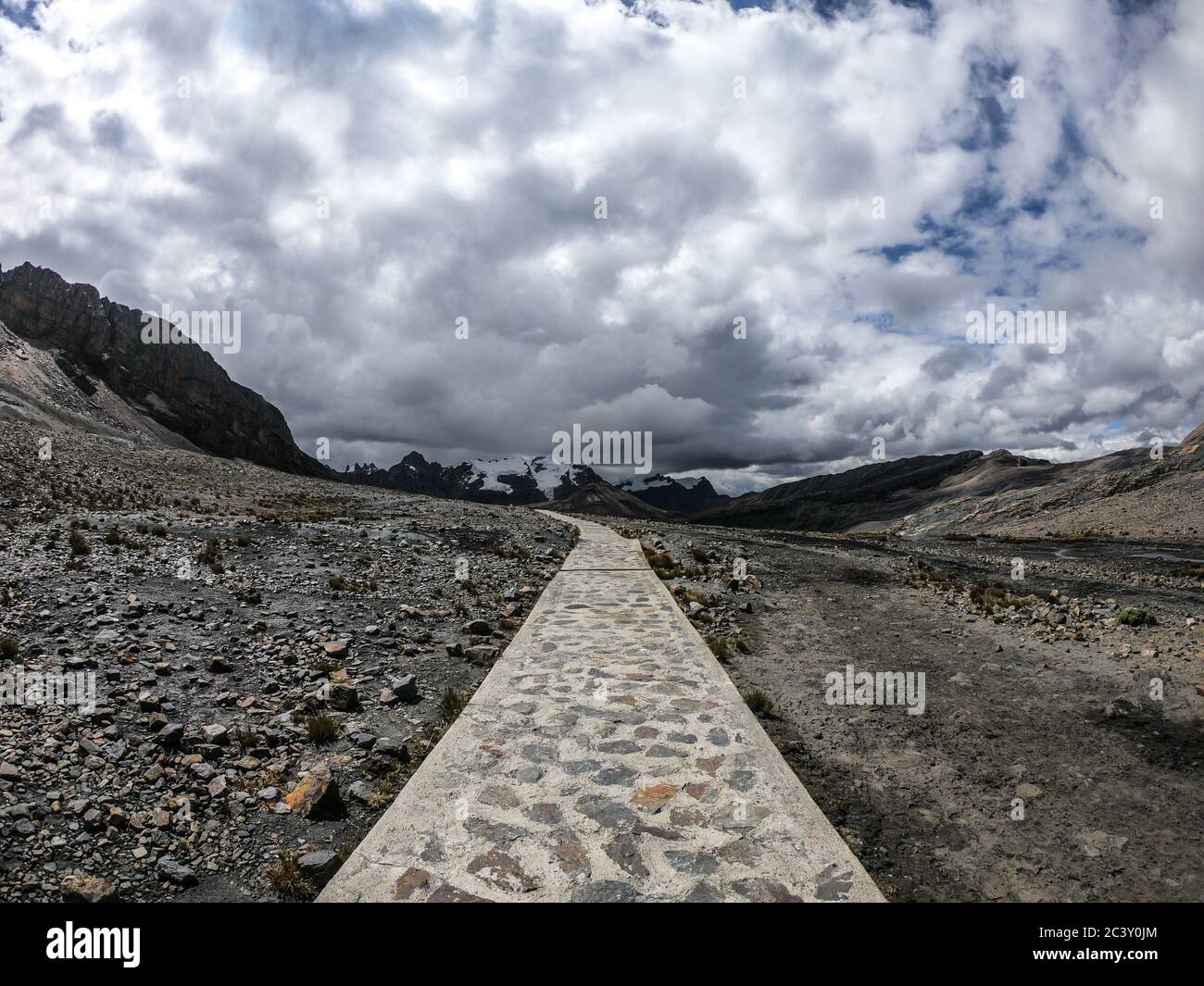 path in the middle of the mountains, cloudy and no people Stock Photo