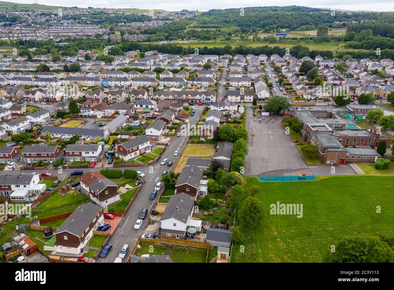 Aerial drone view of a residential area of a small Welsh town surrounded by hills (Ebbw Vale, South Wales, UK) Stock Photo